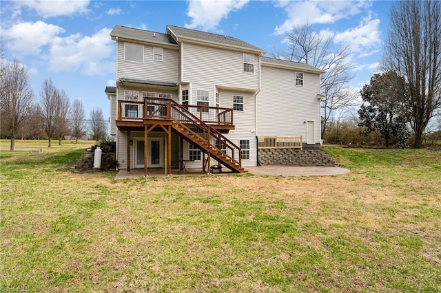 back of property featuring a yard, a patio, a wooden deck, and stairs