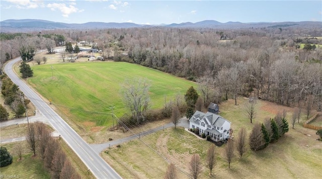 bird's eye view featuring a rural view, a mountain view, and a forest view