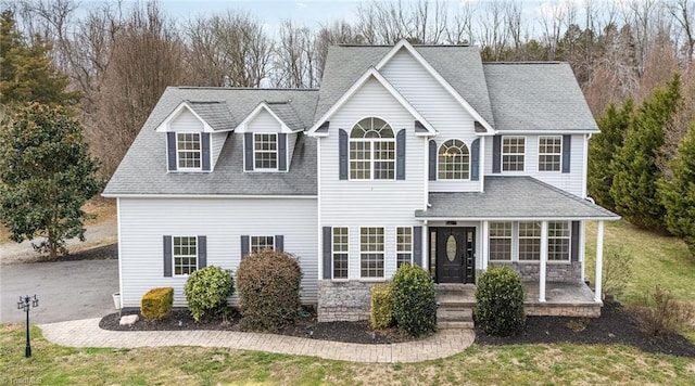 view of front of property with a shingled roof