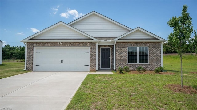 152 Rose Wind Way, Mayodan, NC 27027 - view of front of house with a garage, brick siding, driveway, and a front yard