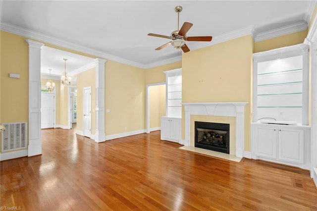 5080 Century Oaks Ln, Winston-Salem, NC 27106 - unfurnished living room featuring a chandelier, a tiled fireplace, wood finished floors, ornamental molding, and a ceiling fan