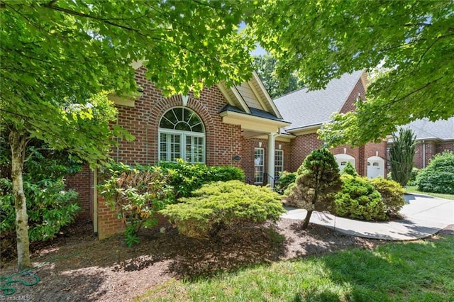 5080 Century Oaks Ln, Winston-Salem, NC 27106 - view of front of house with brick siding, concrete driveway, and an attached garage