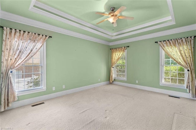 5080 Century Oaks Ln, Winston-Salem, NC 27106 - carpeted empty room with a raised ceiling, crown molding, healthy amount of natural light, a ceiling fan, and baseboards