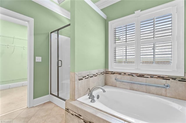 5080 Century Oaks Ln, Winston-Salem, NC 27106 - full bathroom featuring a stall shower, a bath, a walk in closet, crown molding, and baseboards
