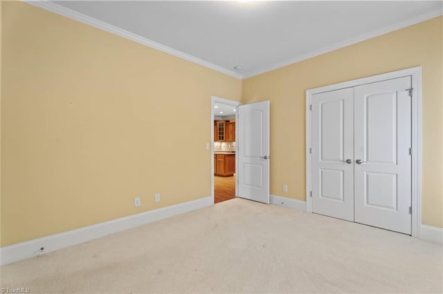 5080 Century Oaks Ln, Winston-Salem, NC 27106 - unfurnished bedroom featuring carpet floors, crown molding, baseboards, and a closet