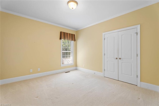 5080 Century Oaks Ln, Winston-Salem, NC 27106 - unfurnished bedroom with crown molding, carpet, baseboards, and a closet