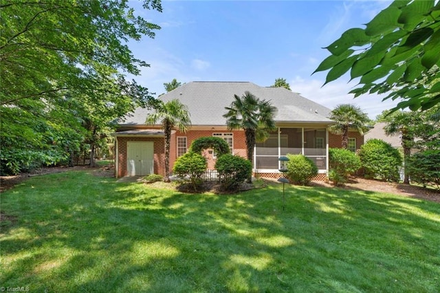 5080 Century Oaks Ln, Winston-Salem, NC 27106 - view of front of property with a sunroom, a front yard, and brick siding