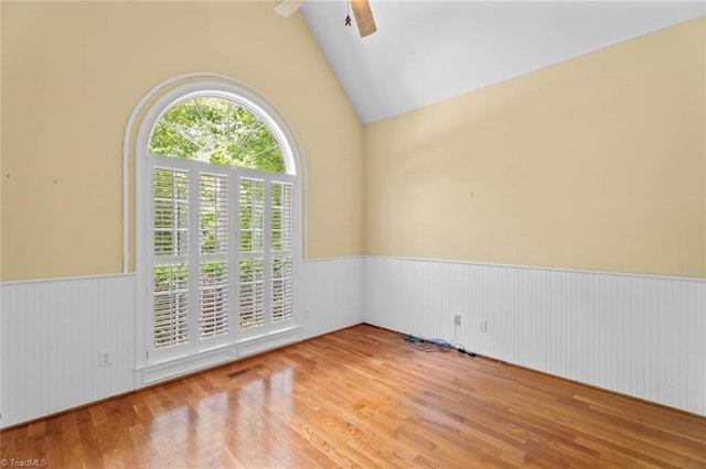 5080 Century Oaks Ln, Winston-Salem, NC 27106 - unfurnished room featuring a wainscoted wall, a ceiling fan, wood finished floors, and high vaulted ceiling