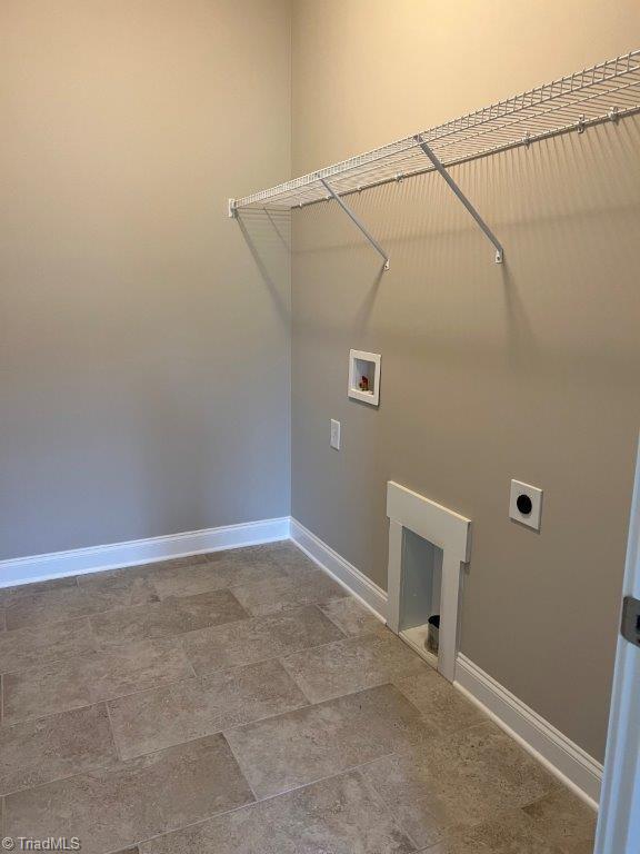 clothes washing area featuring hookup for an electric dryer and hookup for a washing machine