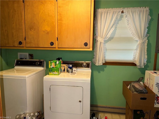 washroom featuring cabinets and washing machine and dryer