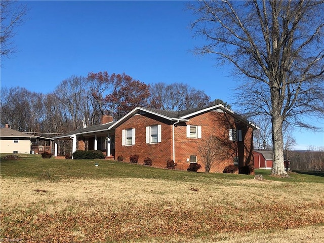 view of home's exterior with a yard