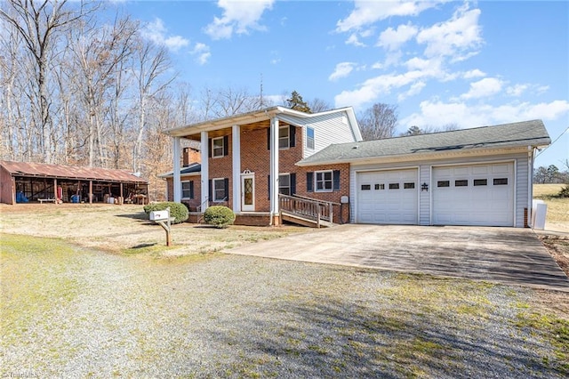 greek revival house featuring a garage