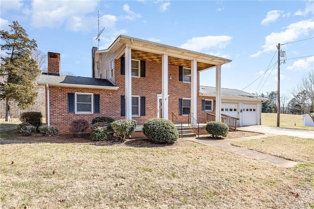 view of front of home with a front lawn and a garage