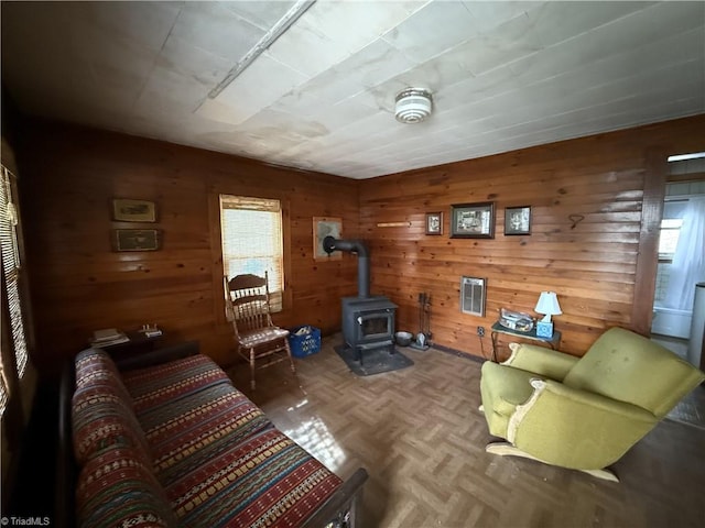 8253 N NC Highway 16, Millers Creek, NC 28651 - living room featuring a wood stove and wood walls