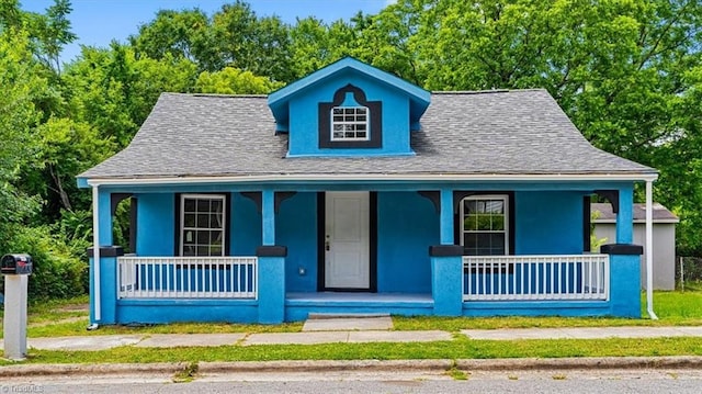 1224 Downing St, High Point, NC 27260 - bungalow-style home with covered porch, a shingled roof, and stucco siding