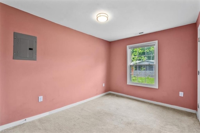 1224 Downing St, High Point, NC 27260 - carpeted empty room featuring electric panel and baseboards