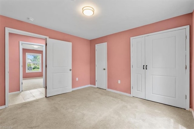1224 Downing St, High Point, NC 27260 - unfurnished bedroom featuring carpet, baseboards, and a closet