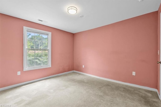 1224 Downing St, High Point, NC 27260 - spare room featuring carpet flooring and baseboards