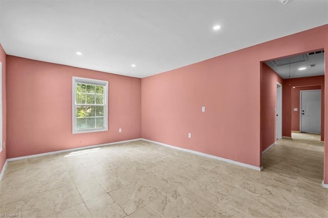 1224 Downing St, High Point, NC 27260 - spare room featuring attic access, baseboards, and recessed lighting