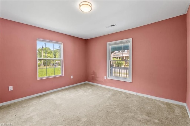 1224 Downing St, High Point, NC 27260 - carpeted spare room with baseboards