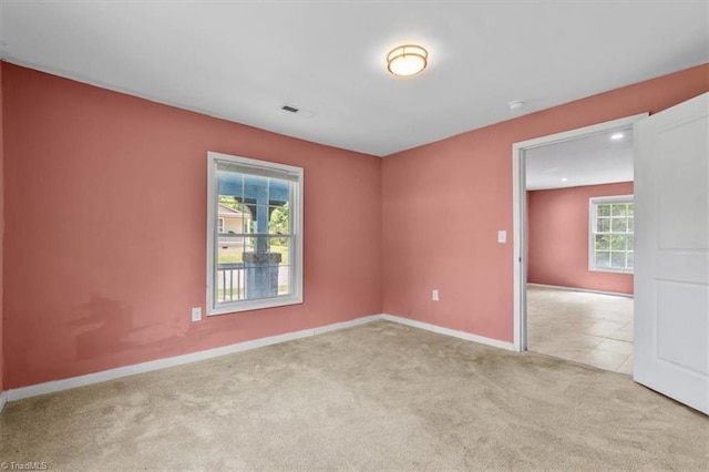 1224 Downing St, High Point, NC 27260 - carpeted empty room with baseboards