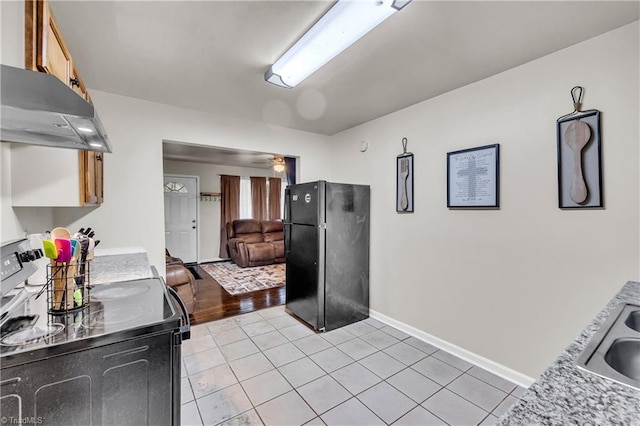 615 Sherman St, Greensboro, NC 27410 - kitchen featuring black appliances, ventilation hood, light countertops, light tile patterned flooring, and a ceiling fan