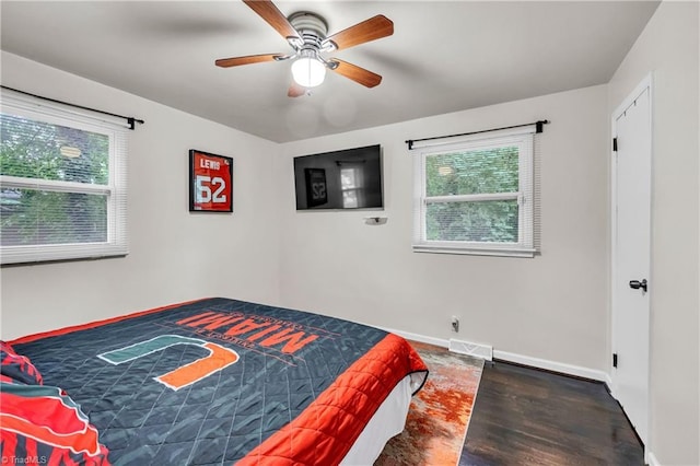 615 Sherman St, Greensboro, NC 27410 - bedroom featuring wood finished floors, baseboards, and ceiling fan