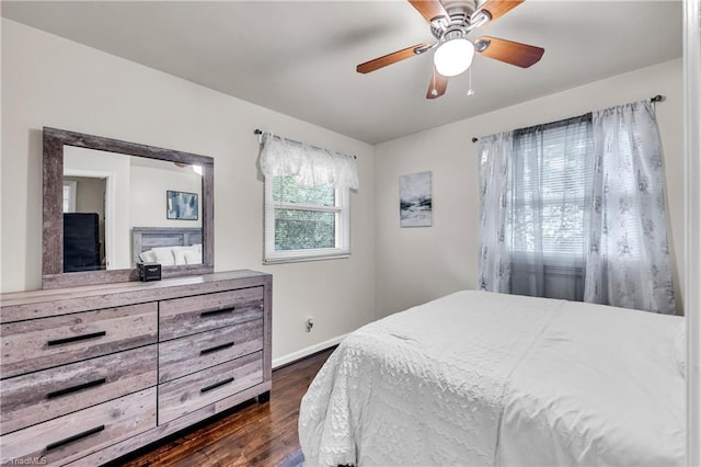 615 Sherman St, Greensboro, NC 27410 - bedroom featuring dark wood-type flooring, baseboards, and a ceiling fan