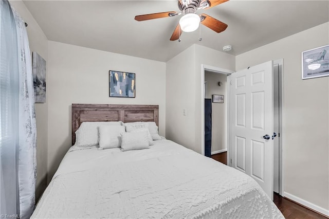 615 Sherman St, Greensboro, NC 27410 - bedroom featuring dark wood-style floors, baseboards, and ceiling fan