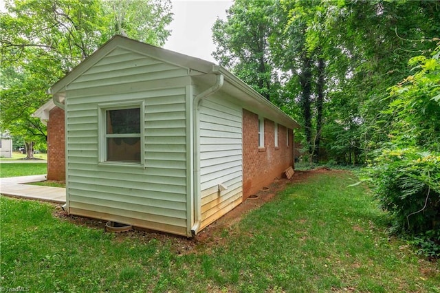 615 Sherman St, Greensboro, NC 27410 - view of side of property with a lawn