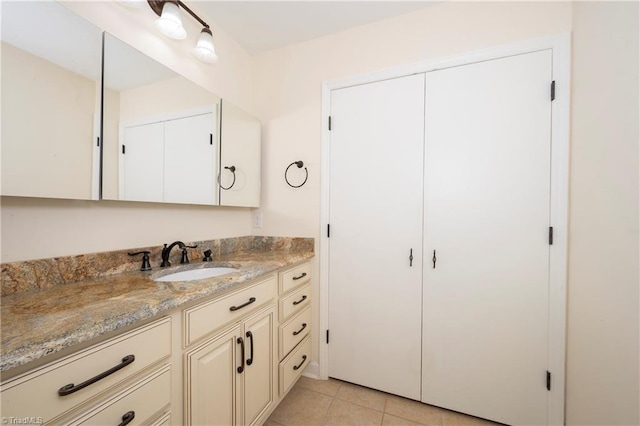 bathroom with tile patterned flooring and vanity