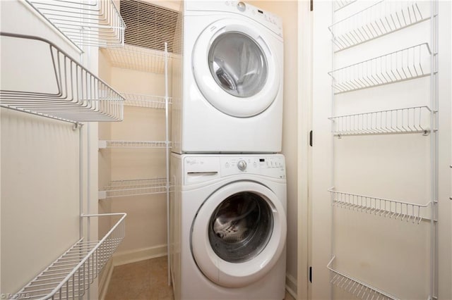 laundry room featuring stacked washer / dryer