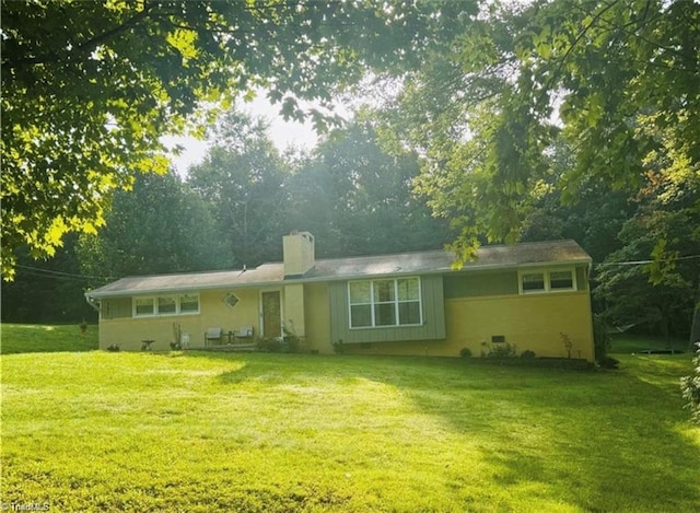 357 Town N Country Dr, Wilkesboro, NC 28697 - back of house with a chimney and a yard