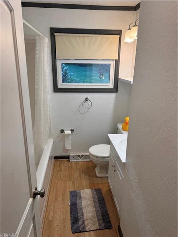 357 Town N Country Dr, Wilkesboro, NC 28697 - bathroom featuring wood finished floors, toilet, vanity, baseboards, and a textured wall