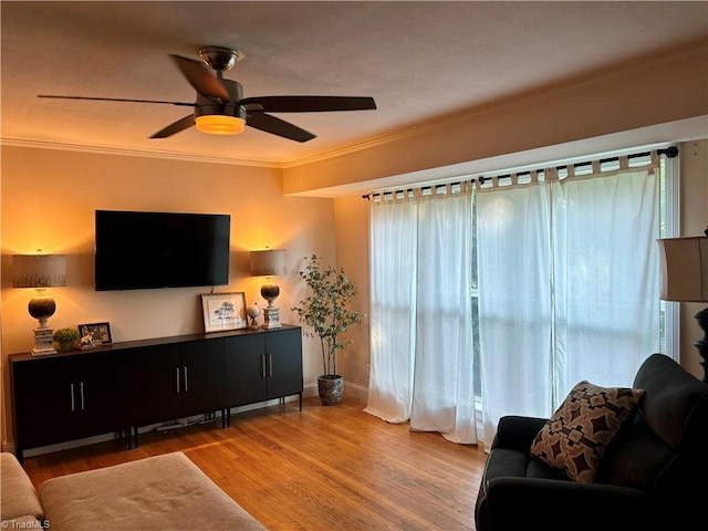 357 Town N Country Dr, Wilkesboro, NC 28697 - living room featuring wood finished floors, ceiling fan, crown molding, and baseboards