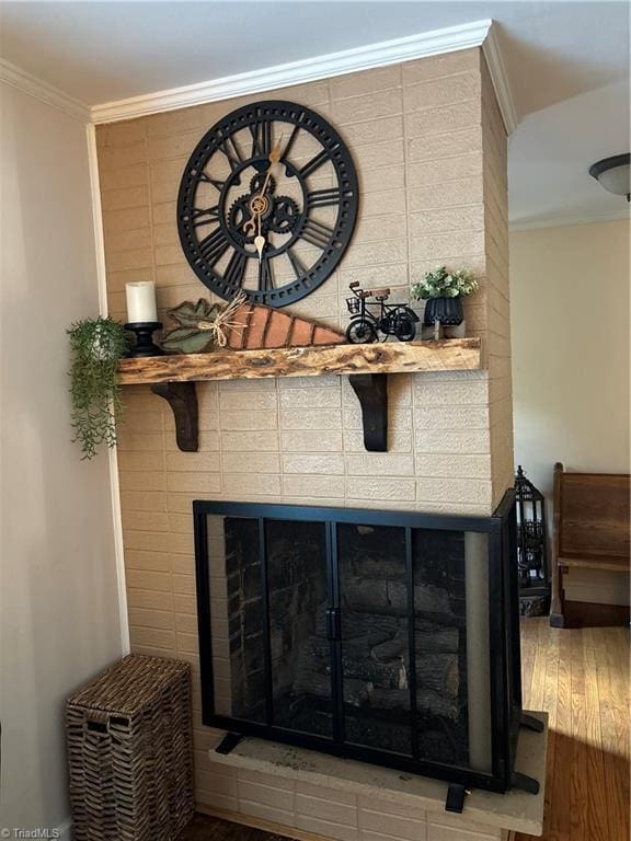 357 Town N Country Dr, Wilkesboro, NC 28697 - detailed view of ornamental molding, wood finished floors, and a fireplace