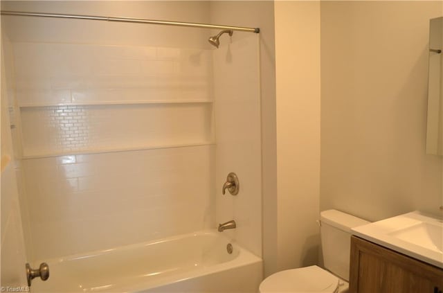 bathroom featuring vanity, toilet, and tub / shower combination