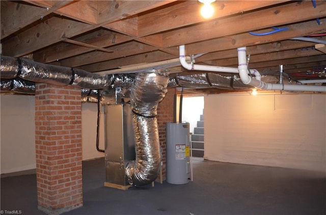 unfinished basement featuring water heater and heating unit