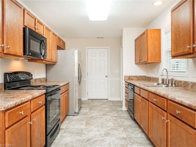 kitchen featuring sink and black appliances