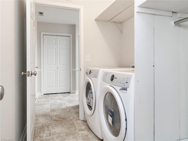 washroom featuring washer and dryer