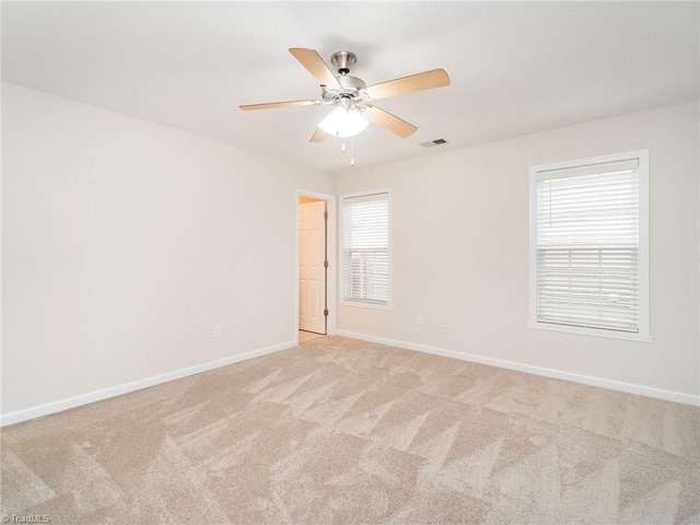 empty room with light carpet and ceiling fan