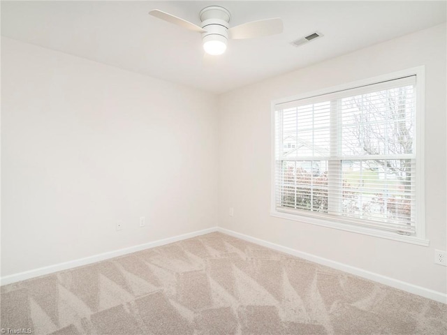 unfurnished room featuring carpet floors and ceiling fan