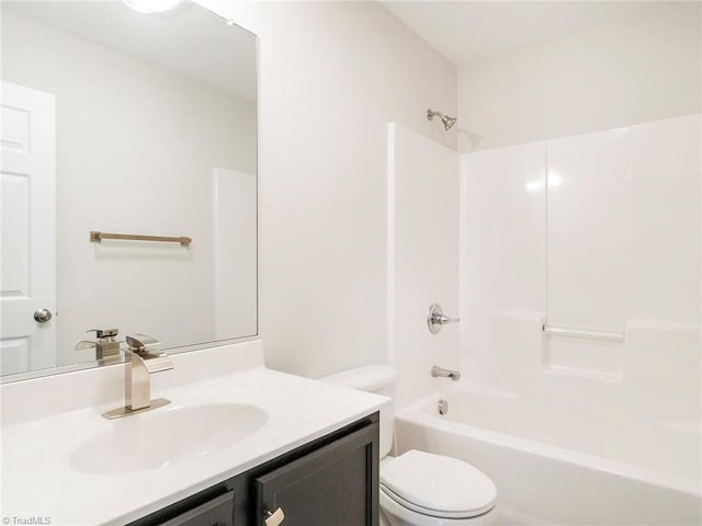 full bathroom featuring vanity, shower / washtub combination, and toilet