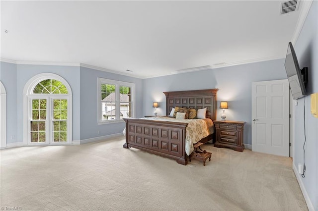 bedroom with ornamental molding, carpet flooring, baseboards, and visible vents