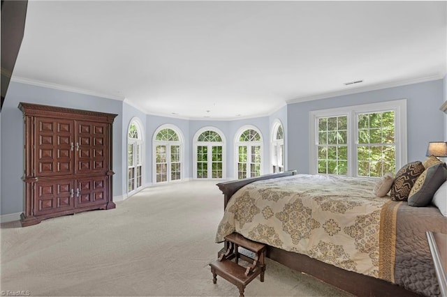 bedroom featuring crown molding, visible vents, baseboards, and carpet floors