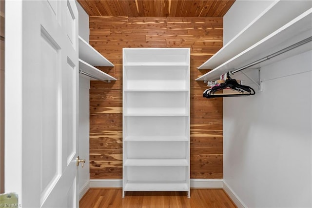 walk in closet featuring wood finished floors