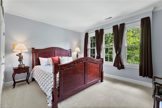 bedroom with crown molding, light carpet, baseboards, and visible vents