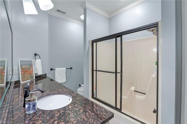 bathroom with a skylight, ornamental molding, a shower stall, and visible vents
