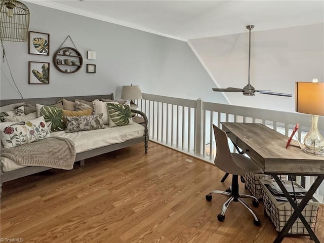 home office featuring ornamental molding, a ceiling fan, and wood finished floors