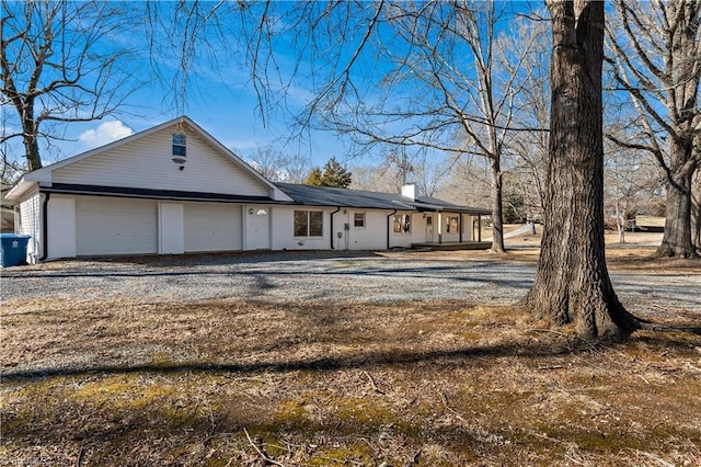 ranch-style home featuring a garage